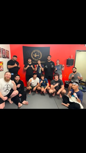 Odyssey MMA students posing together after class
