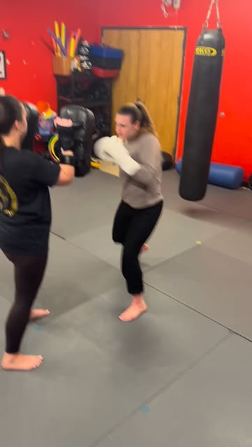 Students doing pad work training